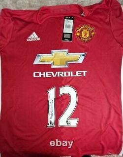 CHRIS SMALLING Signed Manchester United Shirt. Still in original Sleve/Envelope