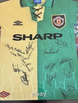Manchester United signed 1992/94 signed green and gold away shirt